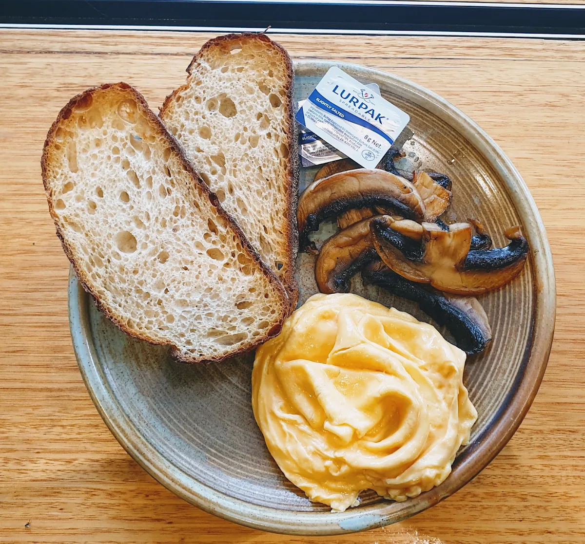 Scrambled Eggs on Sourdough Toast and Mushrooms