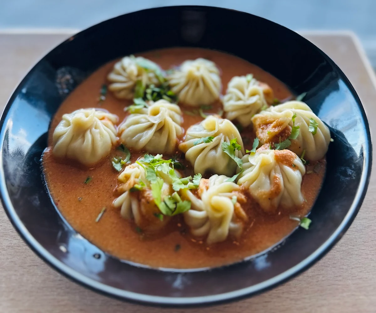 Steamed Dumplings with Soup Jhol Momo Chicken Pork or Vegan