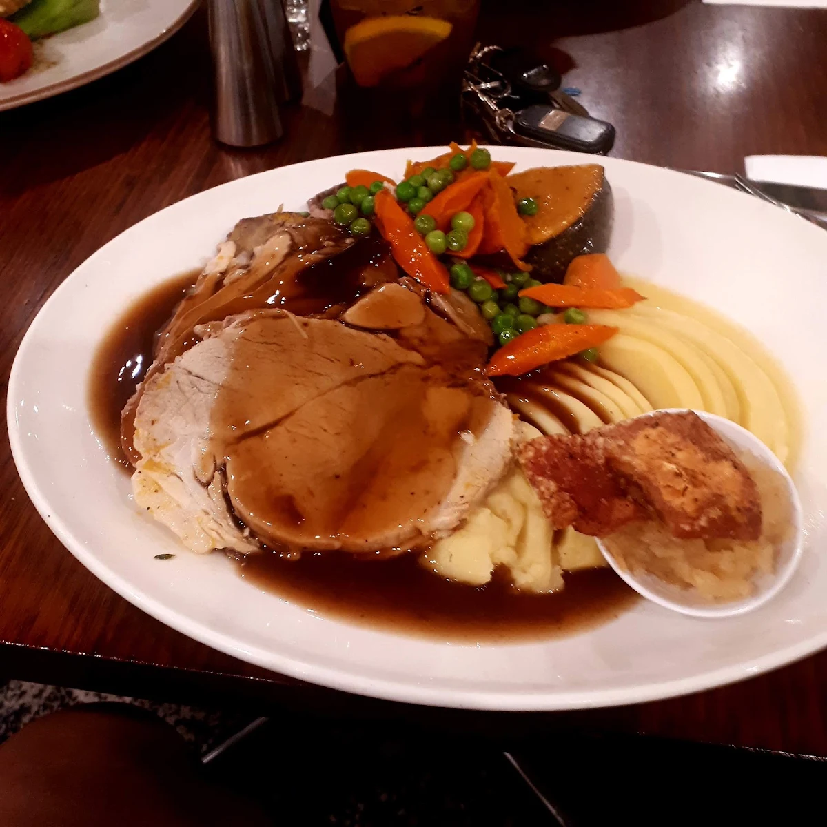 Roast Pork and Mashed Potatoes Veges Gravy and Crackle on Apple Stew