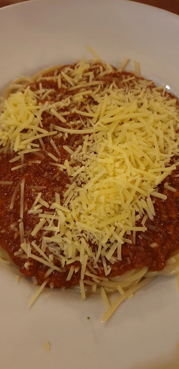 Some Parmesan Cheese Shavings on Spaghetti Bolognese