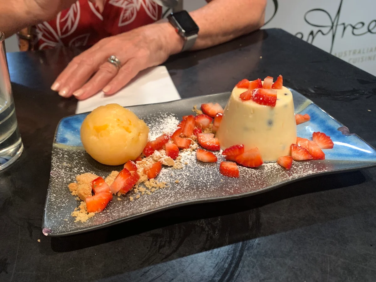 Passionfruit Panna Cotta with Homemade Orange Sorbet Strawberries and Vanilla Crumb