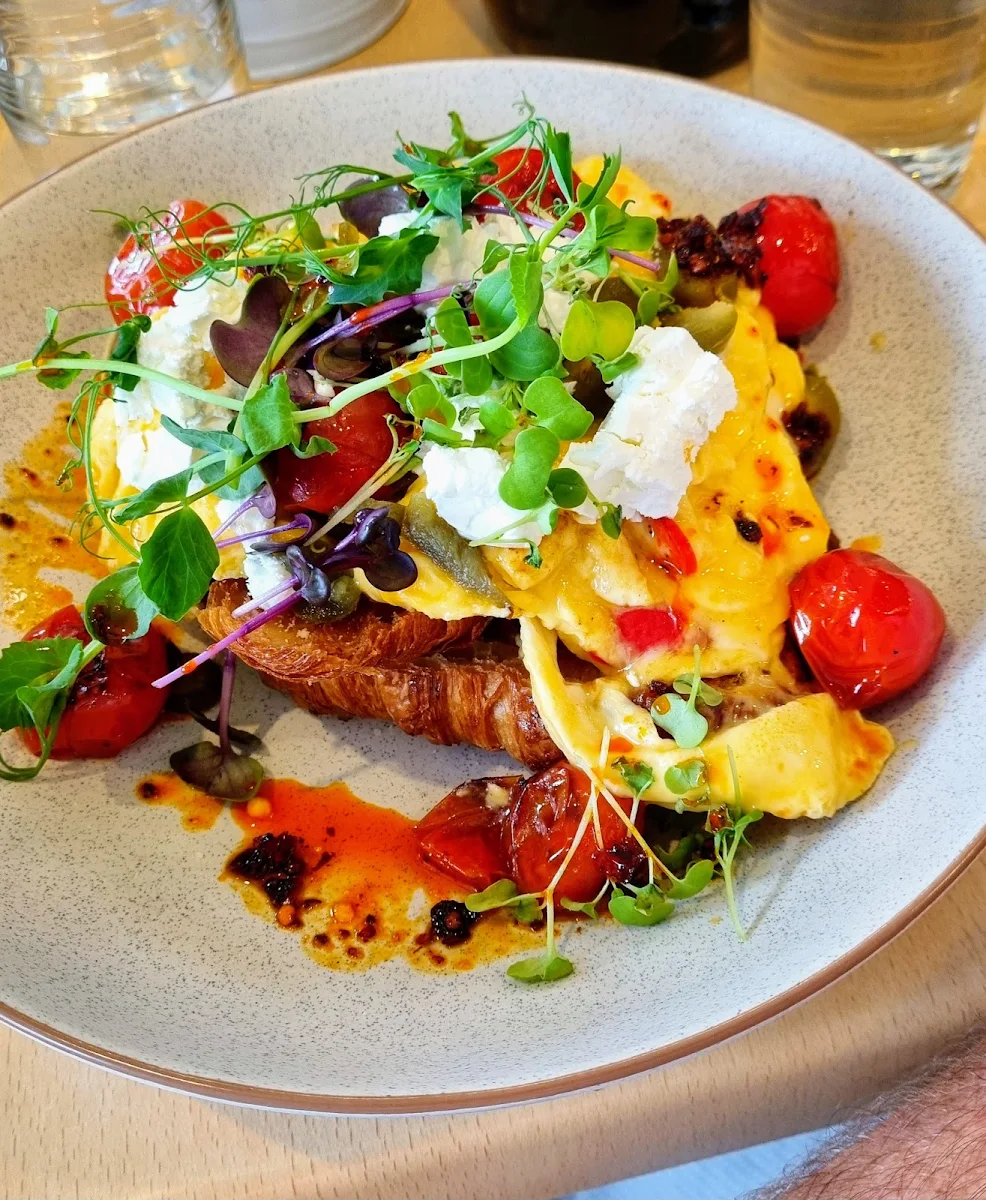Salad and Eggs on a Croissant Sandwich