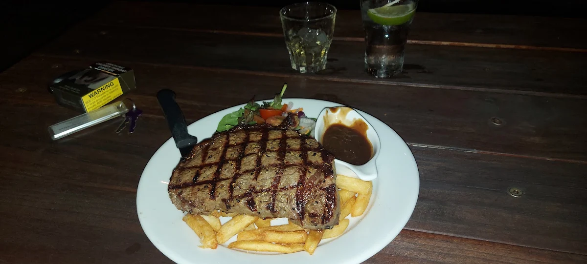 Rib Fillet Medium-Rare with Fries Salad and Peppercorn Gravy