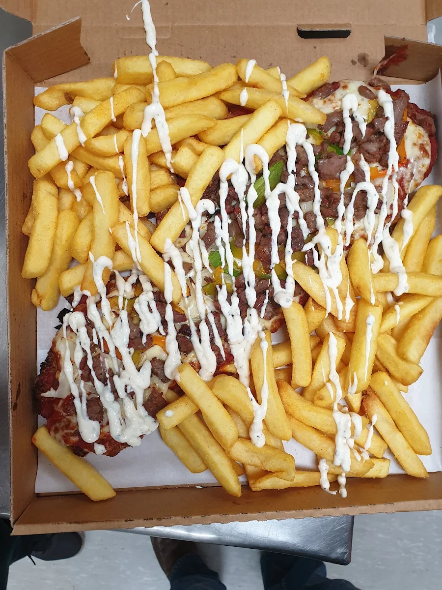 Lamb Yirros on Chicken Parmigiana with Garlic Sauce