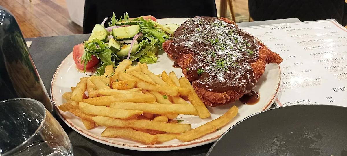 Chicken Schnitzel with Potato Wedges and Coleslaw or Garden Salad