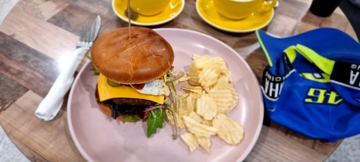 Beef and Bacon Burger with Chips and Fried Egg