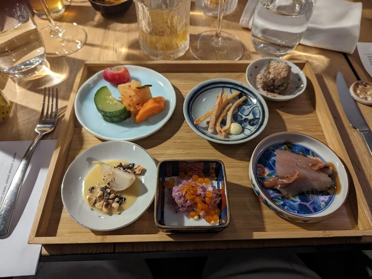First Course Including Pickled Vegges and Kimchi Squid Mushroom Tofu and Kingfishi