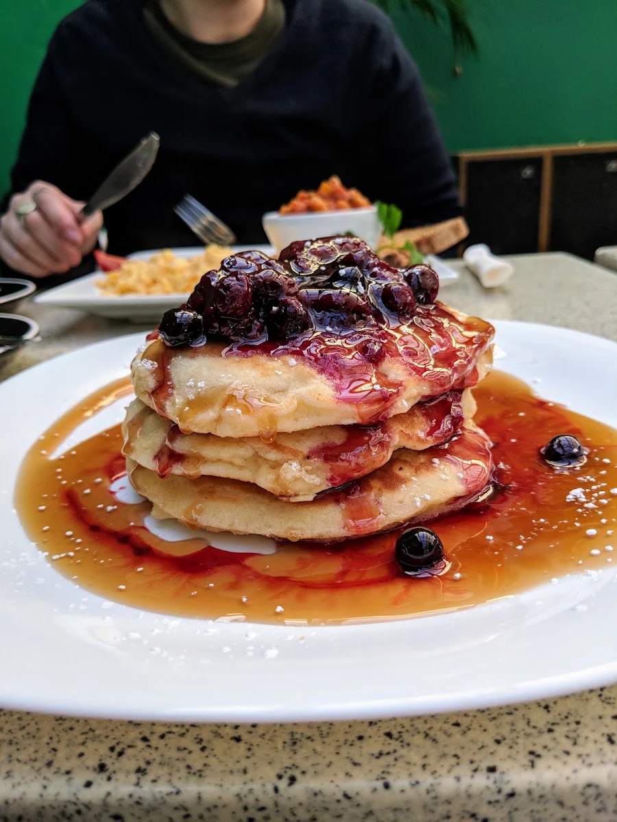 Ricotta Hot Cakes with Bacon Banana and Maple Syrup or with Berry Compote and Maple Syrup