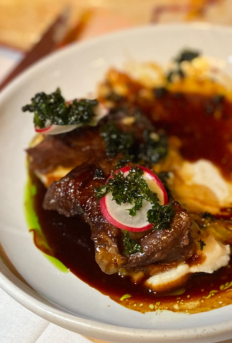 Braised Beef Cheek Cavero Nero Cauliflower Puree Date & Black Garlic Jus
