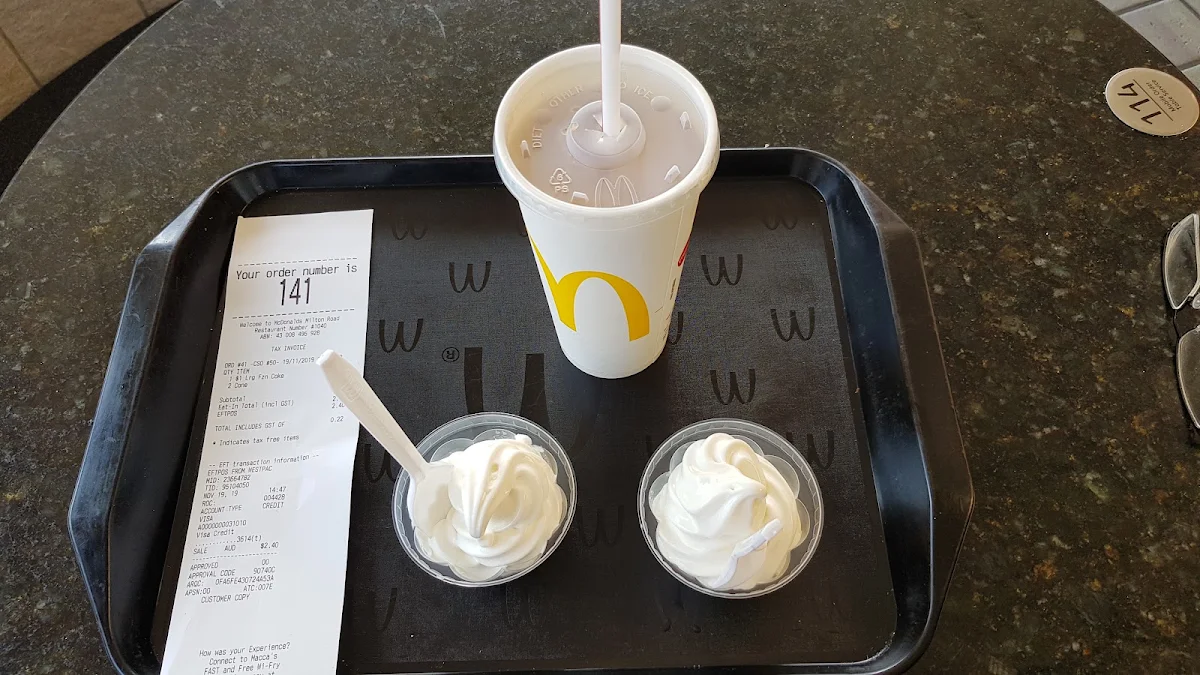 2x Soft Serve Cone They Ran Out of Cones Hence the Plastic Cup Lids and 1x Frozen Coke