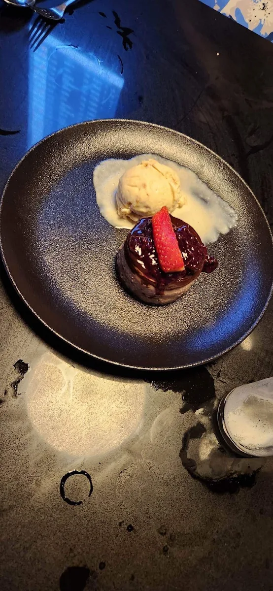 Baked Ricotta Cheese Cake with Mixed Berries Toffee Ice Cream and Caramel Sauce