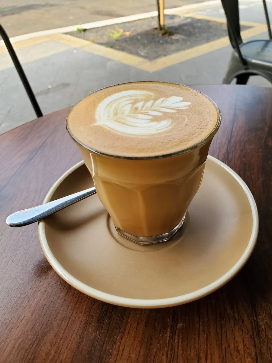 Flat White, Top Impression Bakery Mascot