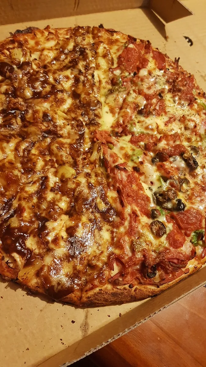 Half and Half Hawaiian Chicken and Hoppers Special Pizza