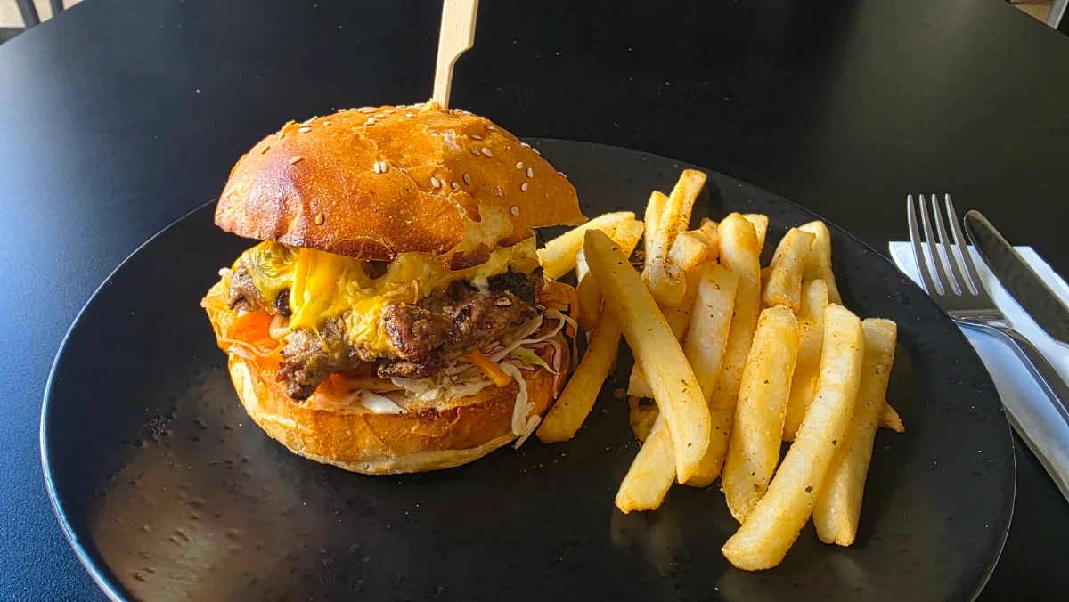 Grilled Marinated Beef Burger Kimchi Cheese Aioli & Chips