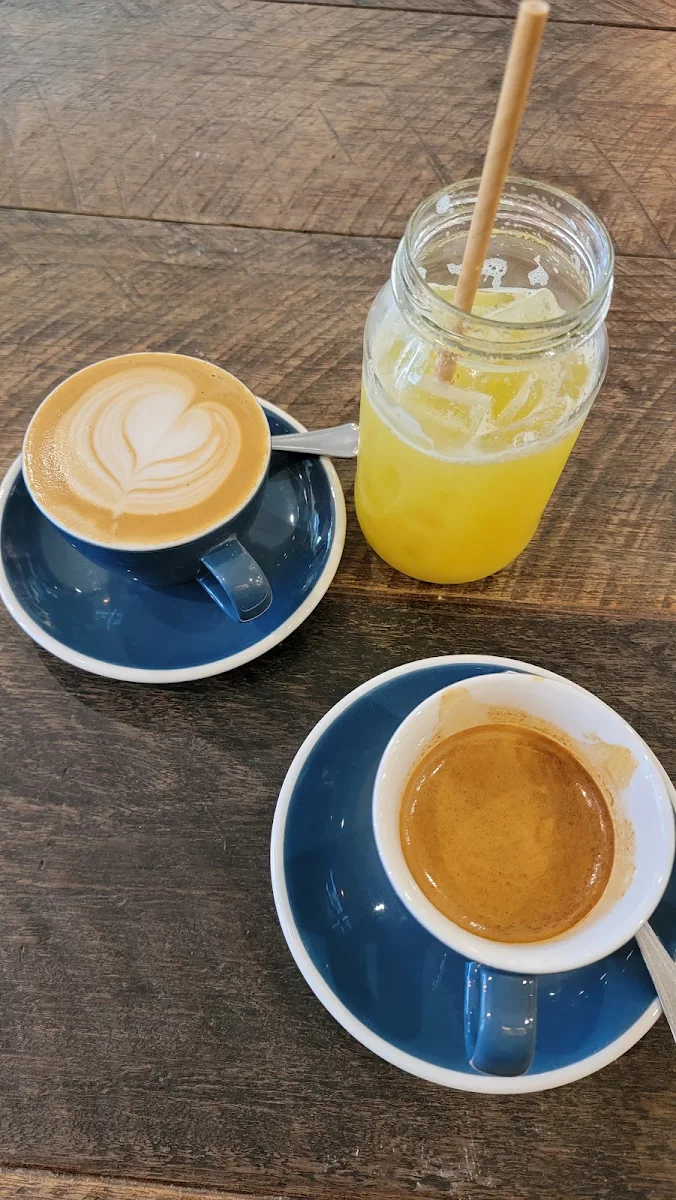 Beautifully Poured Long Black Alatte and Freshly Squeezed Apple and Pineapple Juice