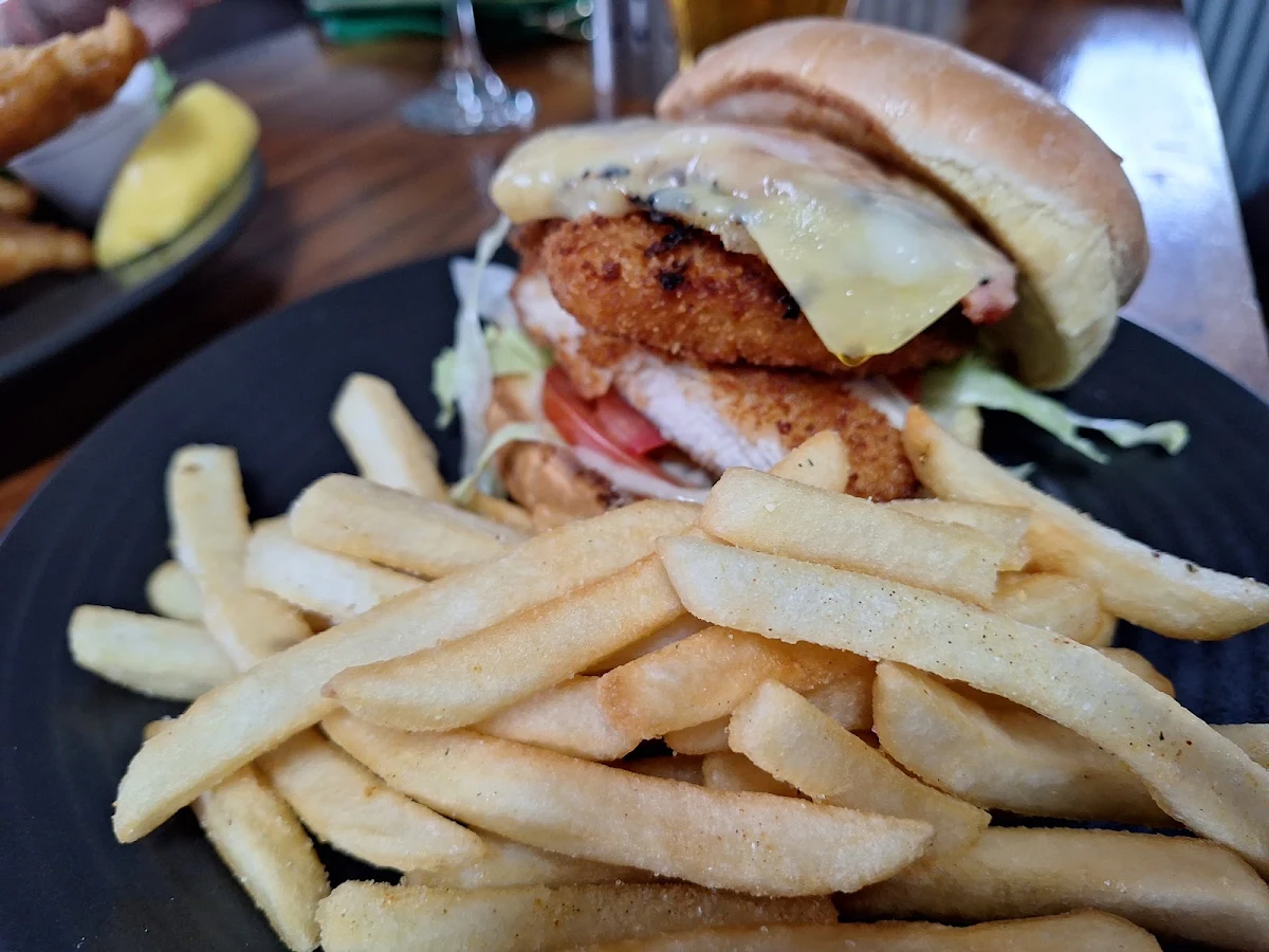 Slaw & Peri Peri Sauce Served on a Brioche Bun with Chips