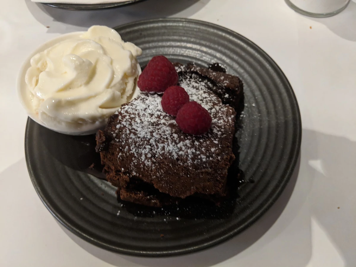 Chocolate Brownie with Vanilla Bean Ice Cream and Raspberry