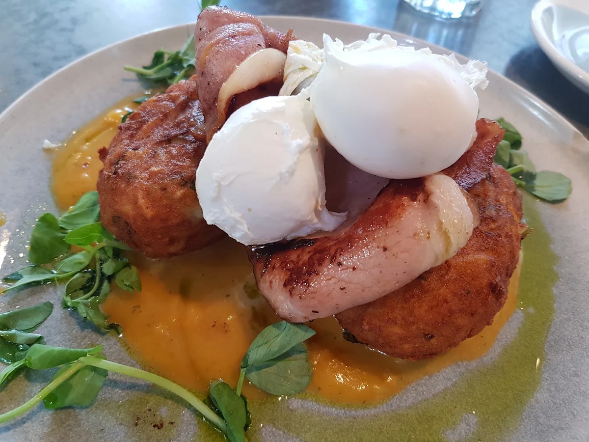 Potato Stack with Poached Eggs Bacon and Sweet Potato Puree