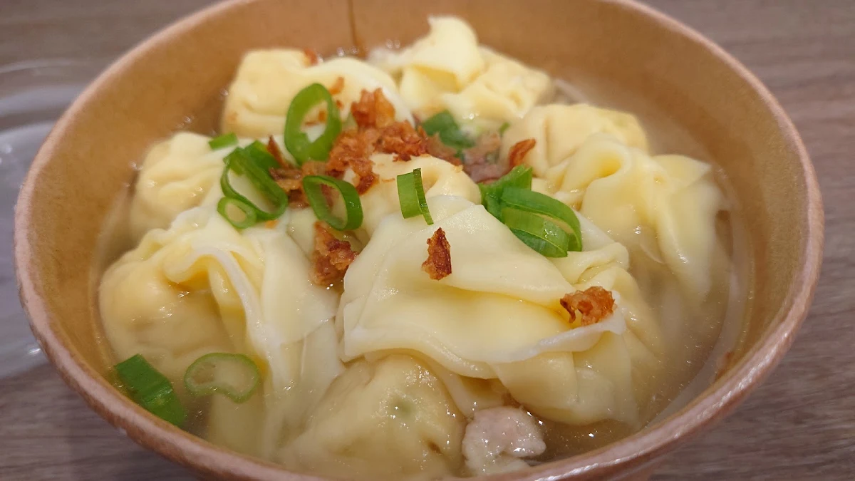 Large Bowl of Pork and Prawn Dumplings in Chichen Broth and Home Made Noodles