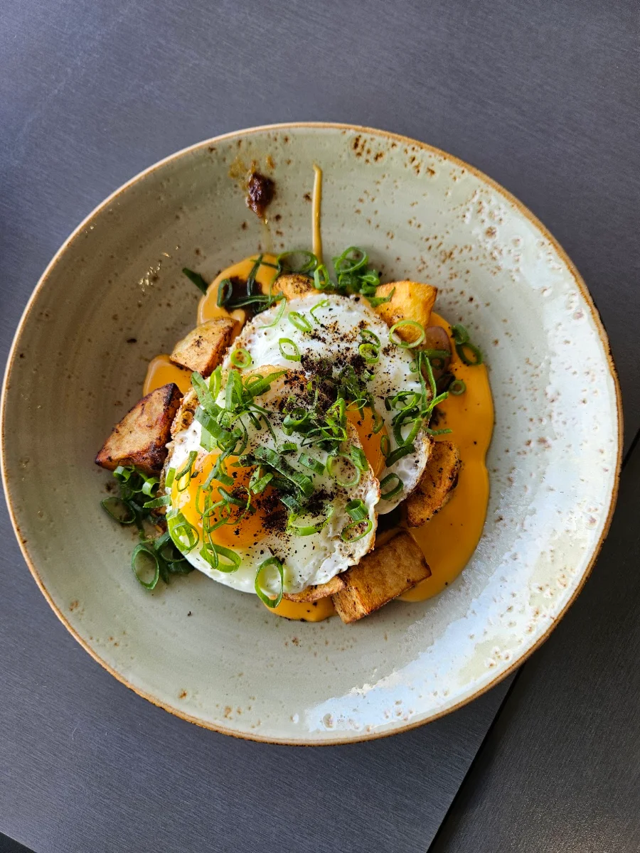 Loaded Eggs Crispy Spiced Potatoes Cheese Sauce Bacon Jam Heirloom Tomatoes Spring