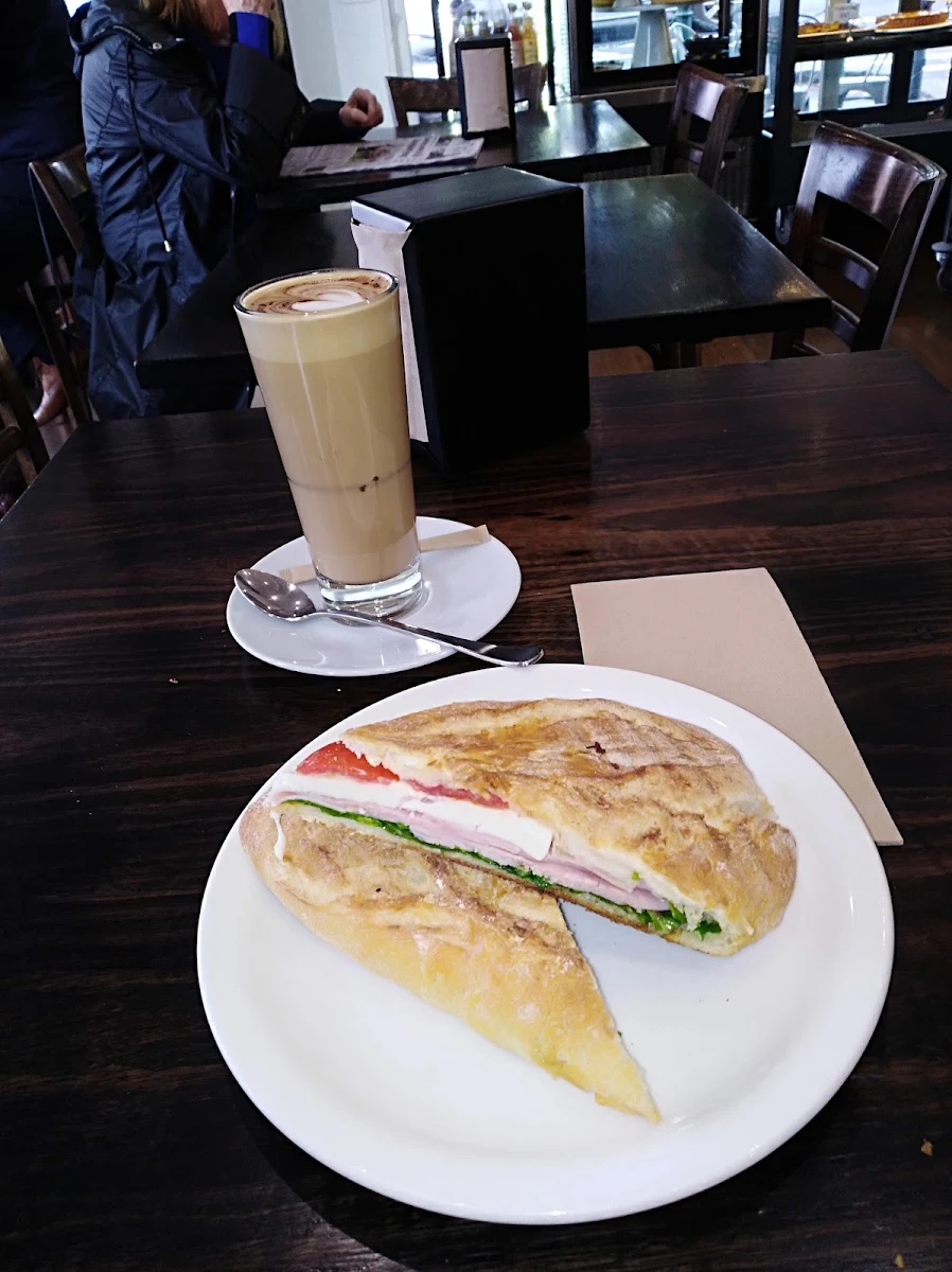 Toasted Ham Camebert Tomato Pesto Facacia with a Tall Latte