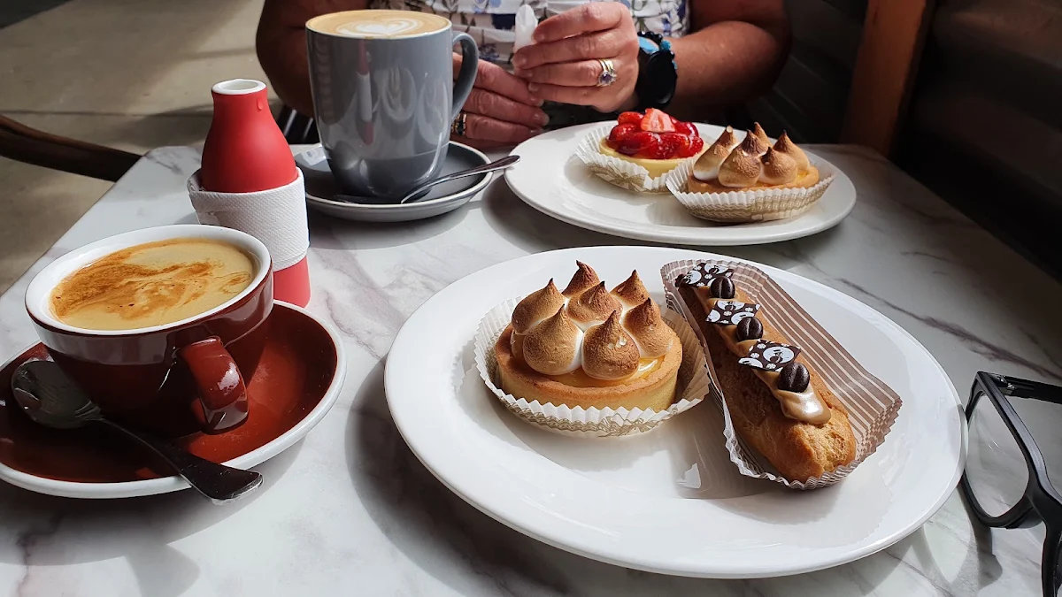 Lemon Meringue Tart Strawberry and Custard Tart Coffee Eclair Long Black Coffee Latte