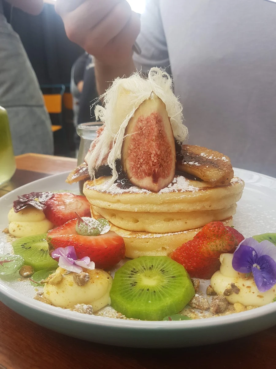 Fluffy Hotcakes Vanilla Mascarpone Fresh Fruit Grilled Banana Maple Syrup Topped with Fairy Floss