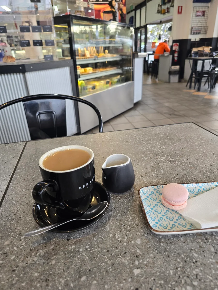 Earle Grey Tea with Oat Milk and a Raspberry Macaroon