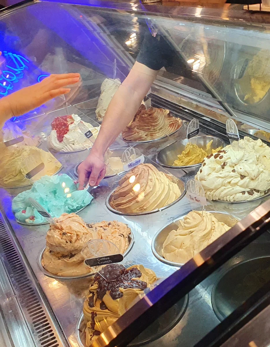 Staff Scooping Up Ice Cream Using Ice Cream Scoop