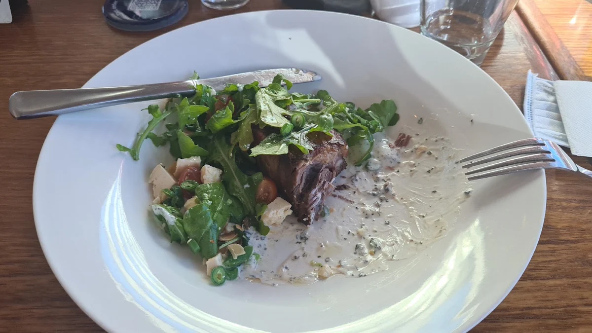 Souve Lamb Leg with Baked Potatoes and Salad with Yoghurt Mint Sauce