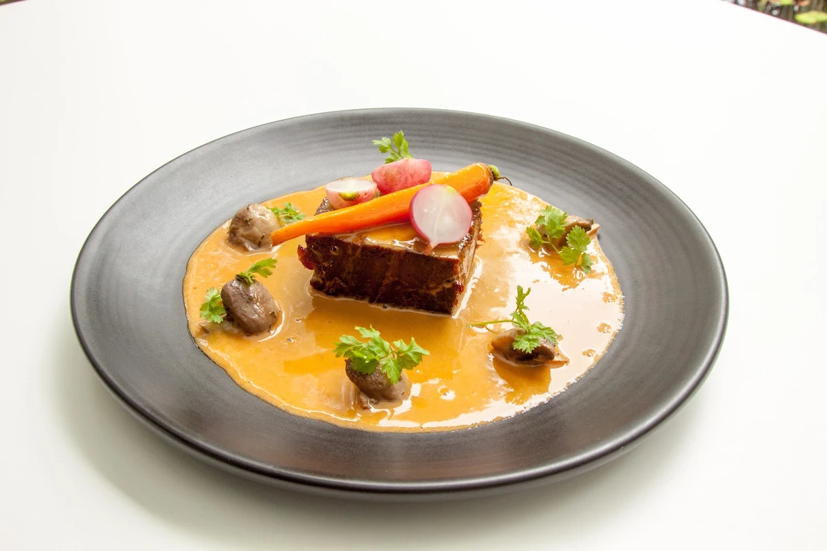 Chargrilled Pork Fillet with Pumpkin Puree Pickled Shallots Crackle & Chilli Oil