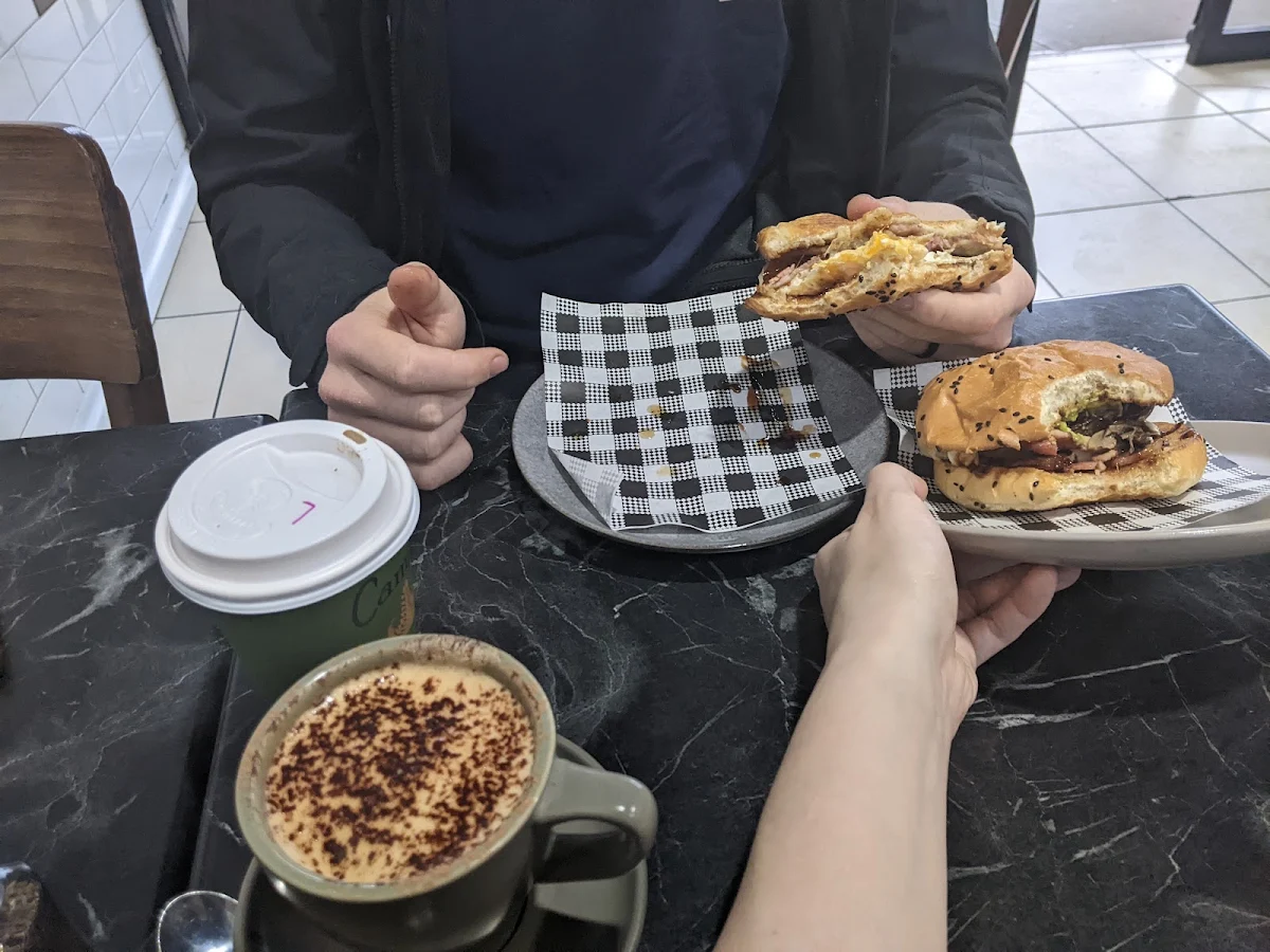 Cappuccino and Bacon and Egg Rolls