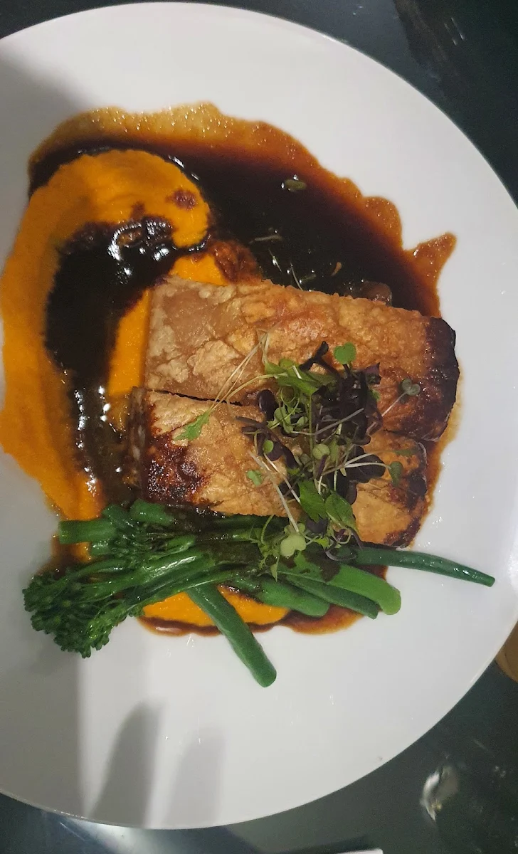 Crispy Pork Belly Ginger Cardomon & Carrot Puree Fennel Leek & Pear Compote Steamed Greens Cider Jus