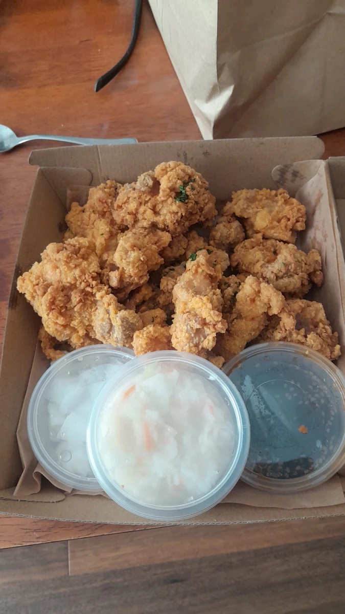 Half Serve Off Boneless Chicken with Sauce on the Side Along with Pickles & Coleslaw Delish