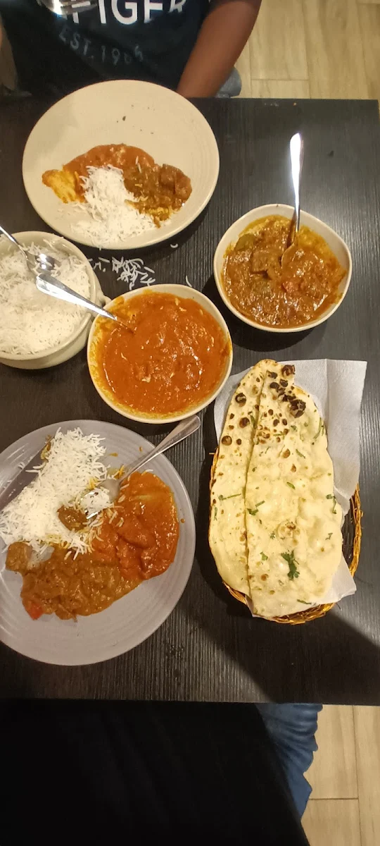 Basmati Steamed Rice with Mango Chicken and Lamb Rogan Josh with Garlic Naan Bread