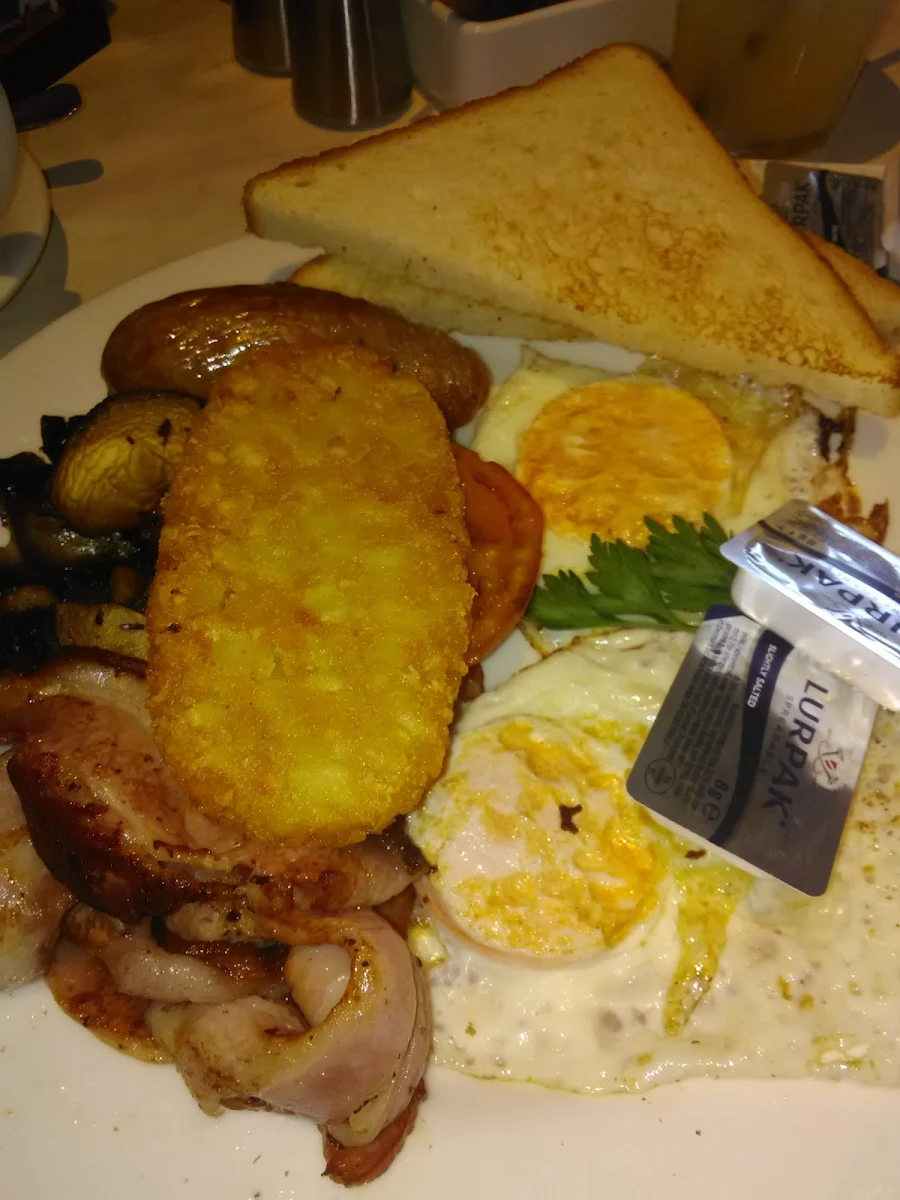 Full Breakfast Bacon Eggs Sausages Tomato Hash Browns and Toast