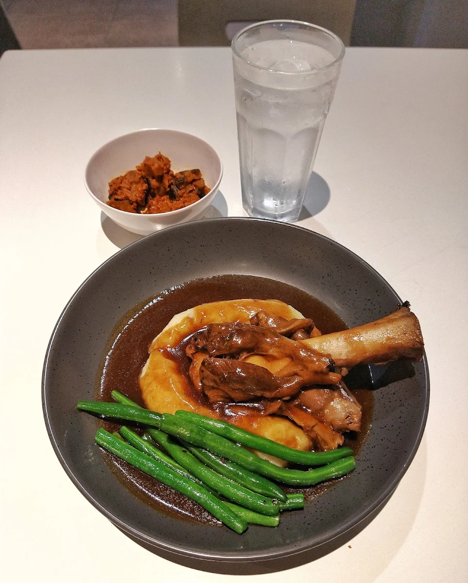 Lamb Shank with Mashed Potatoes Beans and Eggplant Sambal