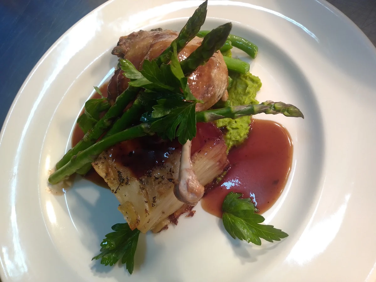Duck Confit Potato Galette Pea Puree Grilled Asparagus and an Port Demi Glaze