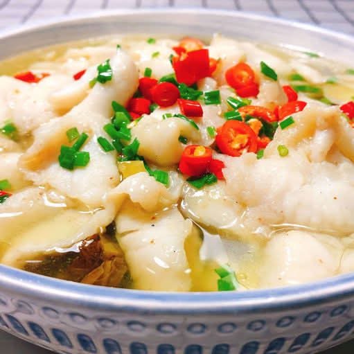 Pickled vegetables and fish fillet in soup