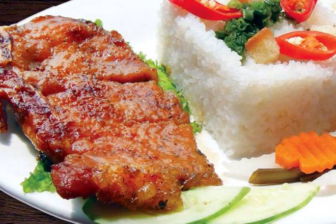 Traditional Vietnamese Broken rice with Grilled Pork chop