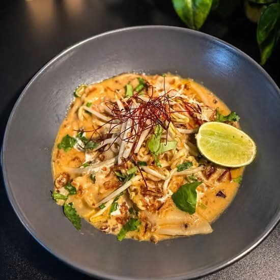 Chicken dumplings in coconut laksa broth with noodles
