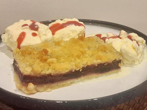 Apple & Wild berry Crumble served with ice cream.