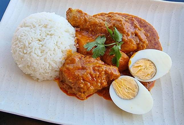 Two hands Chicken Curry with Rice