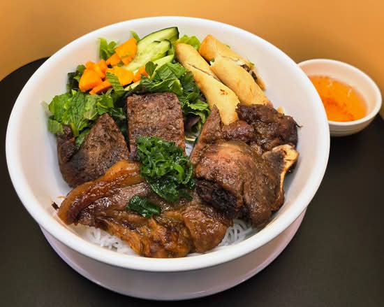 Bún thịt nướng chả giò - Rice Vermicelli Salad with Grilled Pork Chop and Spring Rolls